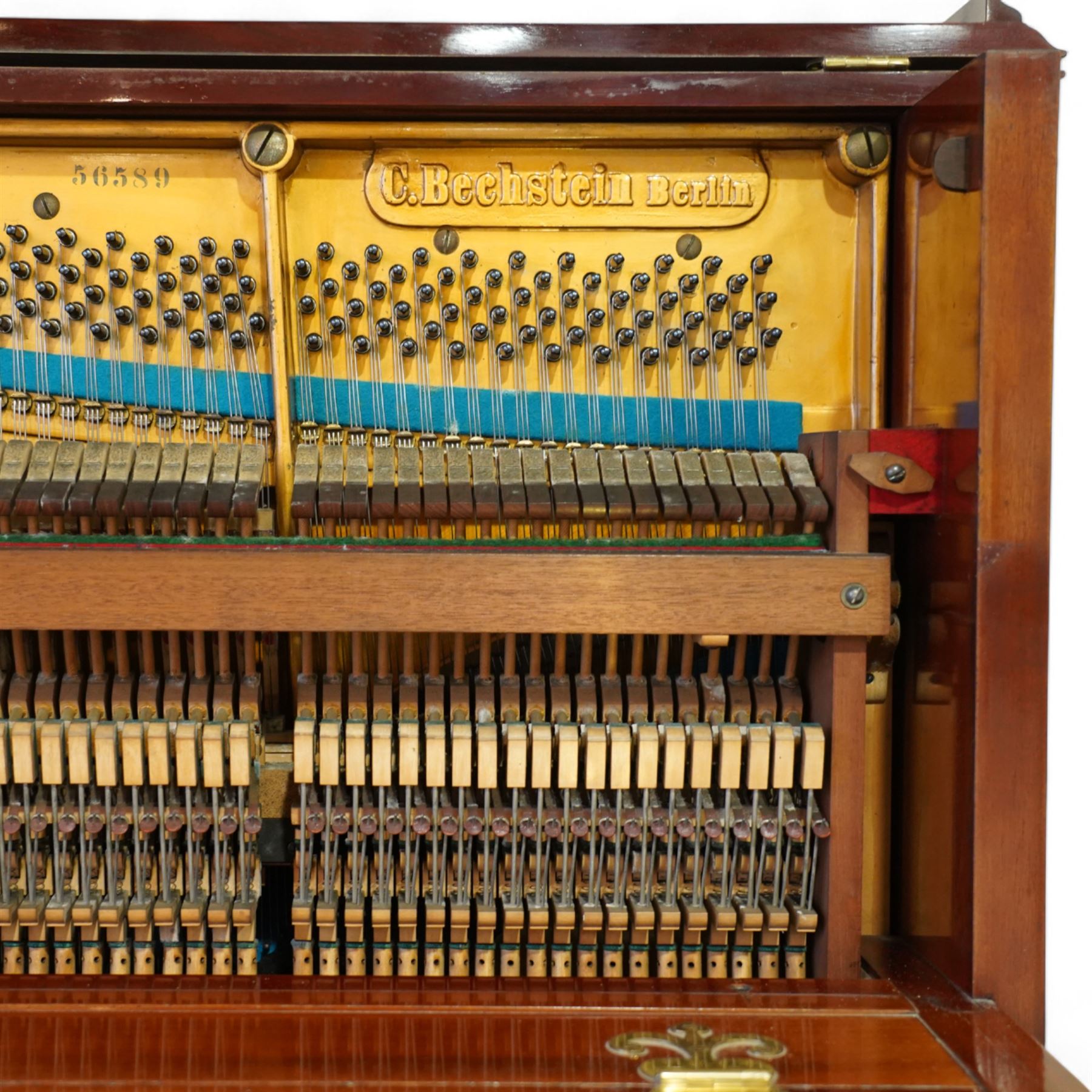 Claud Bechstein- German model IV overstrung upright piano in a mahogany Arts & Crafts designed case by Walter Cave, Serial number 56589 (1900-01), with a lattice music desk and silk backed open fretwork, square key fall with makers name and crafted brass hinges, two candle sconces on tapered square supports, makers name and model number cast into the frame, with an underdamper action, una-corda and sustain pedals, recently re-strung with new tuning pins, responsive action and damping, in very good playing condition, with 85 ivory and ebony keys A0-A7, tuning A=440. Including a period duet stool with a velvet-padded top.
Walter Cave was a leading architect, interior designer, and furniture maker during the Arts & Crafts period, a similar piano to this was owned and played by George Bernard Shaw and is on exhibition at the National Trust property, Shaw's Corner (Hertfordshire).

This item has been registered for sale under section 10 of the APHA Ivory Act, Reference 8P3C9UKA
