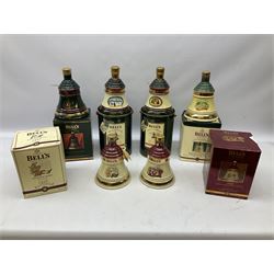 Six Bell's Old Scotch Whisky Christmas ceramic decanters comprising 1988, 1989, 1992, 1996, 1997 and 1998 all in original boxes and decanter seals intact 