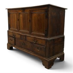 18th century oak hall cupboard, rectangular top with moulded edge, over two panelled hutch-cupboards, the base fitted with six assorted drawers, on large bracket feet