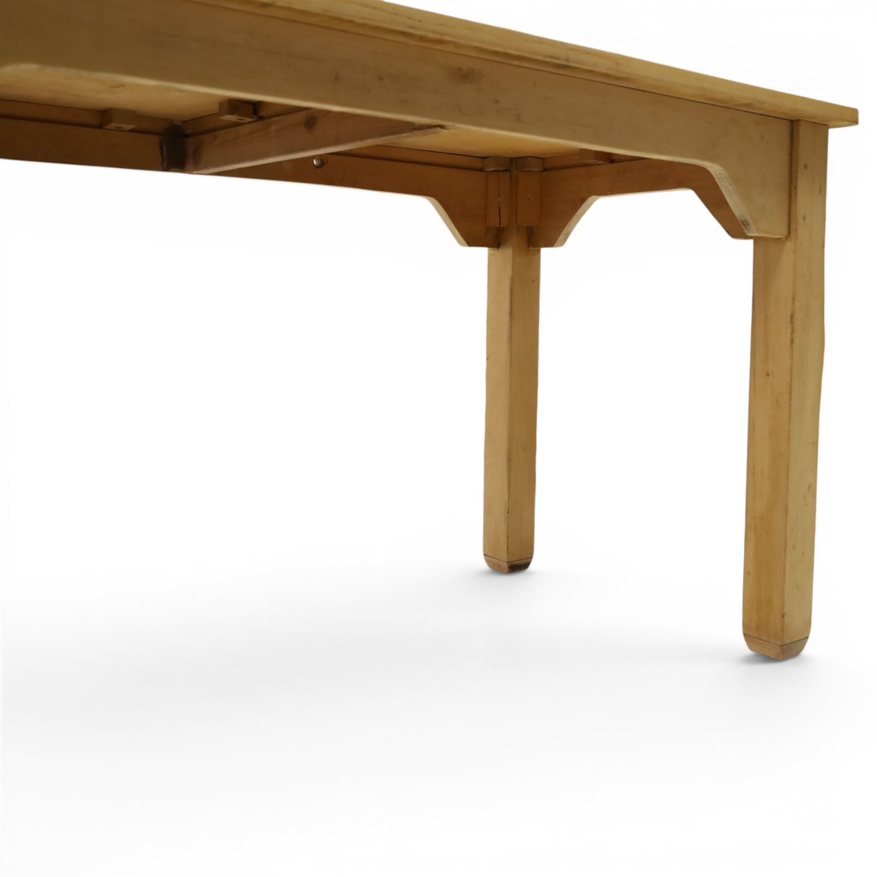 Mid 20th century beech dining table, rectangular top with rounded corners, plain apron with shaped brackets, raised on six square section supports