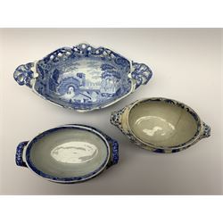Early 19th century Spode blue and white twin handled basket, with osier moulded sides and pierced rim, decorated in the Castle pattern, L26.5cm, together with two early 19th century Spode blue and white soup tureens (lacking covers), the first example decorated in the Entrance to the Ancient Granary pattern from the Caramanian series, L18.5cm, the second example decorated in the Italian pattern, L18cm, each with impressed and/or printed marks beneath, (3)