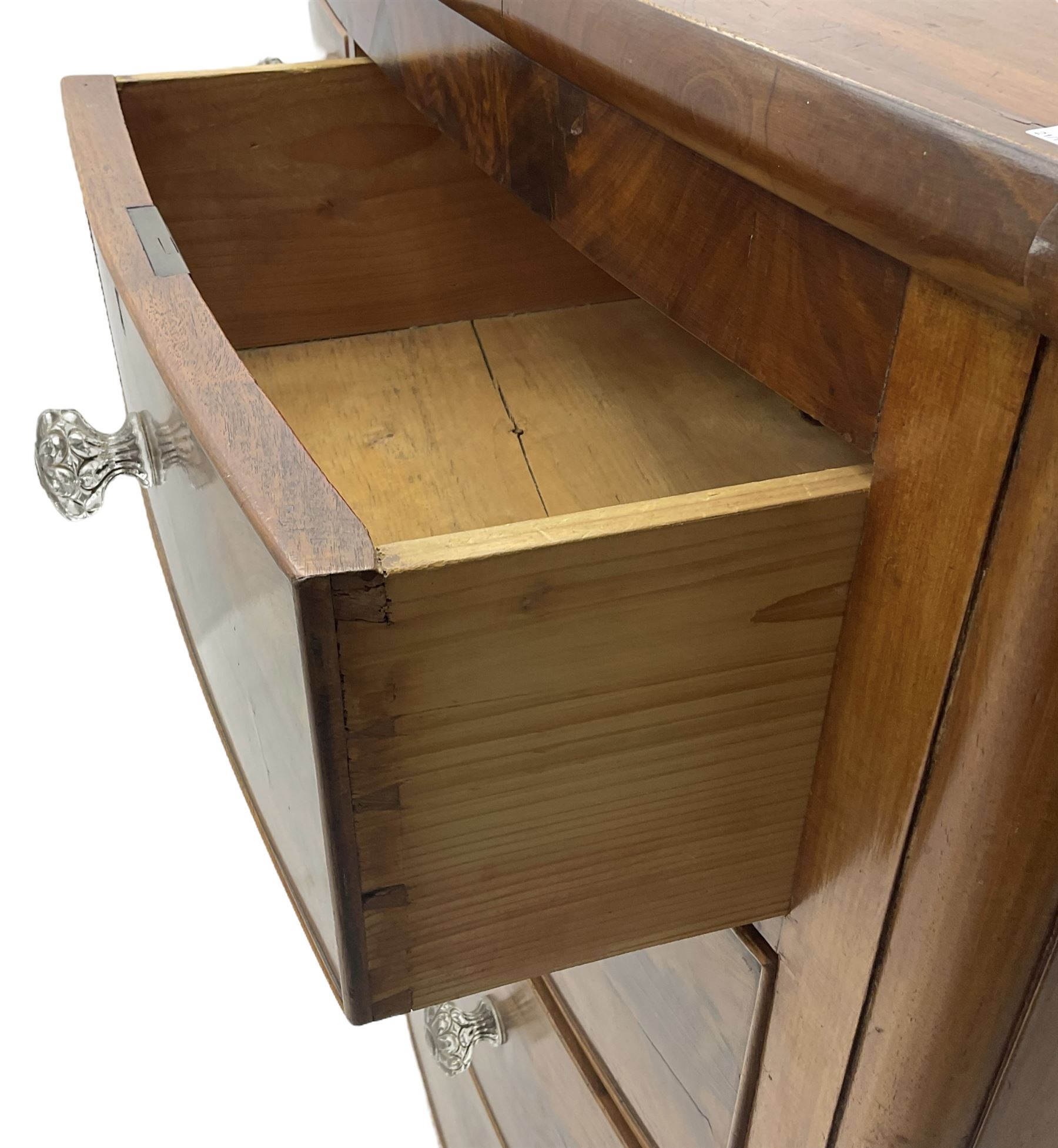 Victorian mahogany bow front chest, fitted with two short over three long graduating cock-beaded drawers, each with glass handles, raised on turned feet