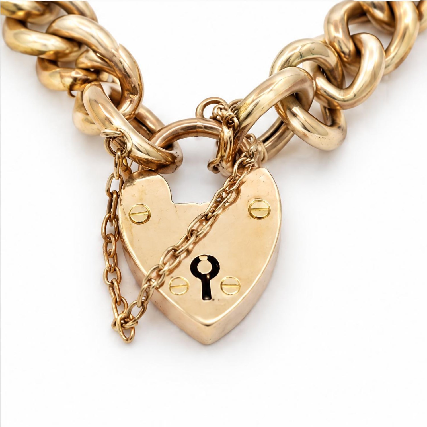Early 20th century gold curb link chain bracelet with heart padlock clasp, by  W.H. Wilmot Ltd, stamped 9ct