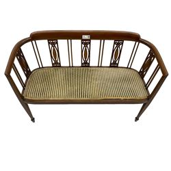 Edwardian inlaid mahogany two-seat salon sofa, curved back and arms inlaid with boxwood stringing, vertical slat back with pierced splats inlaid with satinwood, upholstered seat, on square tapering front supports with spade feet 