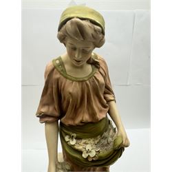 Pair of Royal Dux figures, no. 1115, modelled as a shepherd with a goat by his side and a shepherdess feeding a lamb, each wearing flowing green and pink robes with gilt detailing, with pink triangle mark beneath, H51cm