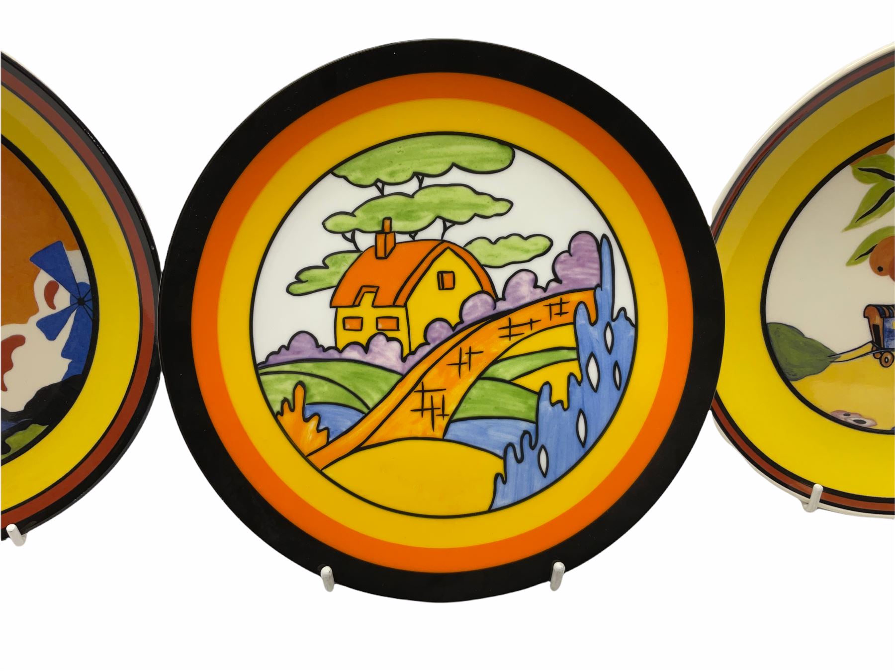 Seven limited edition Wedgwood Clarice Cliff plates, comprising Orange Roof Cottage, Caravan, Windmill, Windbells, Summerhouse, Honolulu and Bridgewater D20.5cm. 