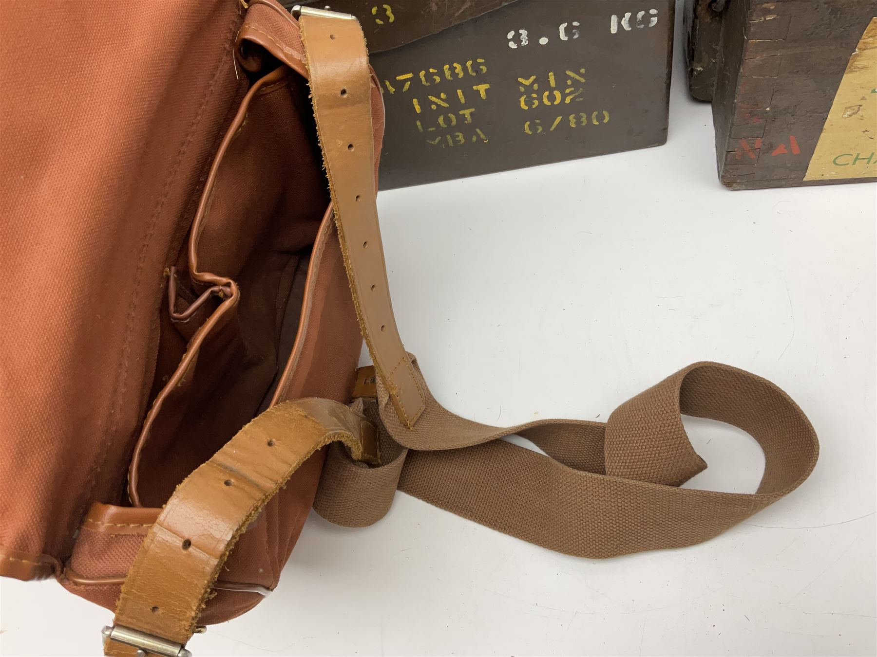 Miscellaneous shooting accessories - W.J. Bowman & Sons clay pigeon launcher; two leather cartridge belts; three cartridge bags; two canvas/leather game bags; and two metal/wooden cartridge boxes