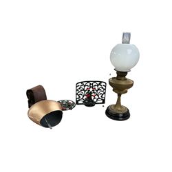 Brass oil lamp, together with cow bell and cast iron book stand and mat