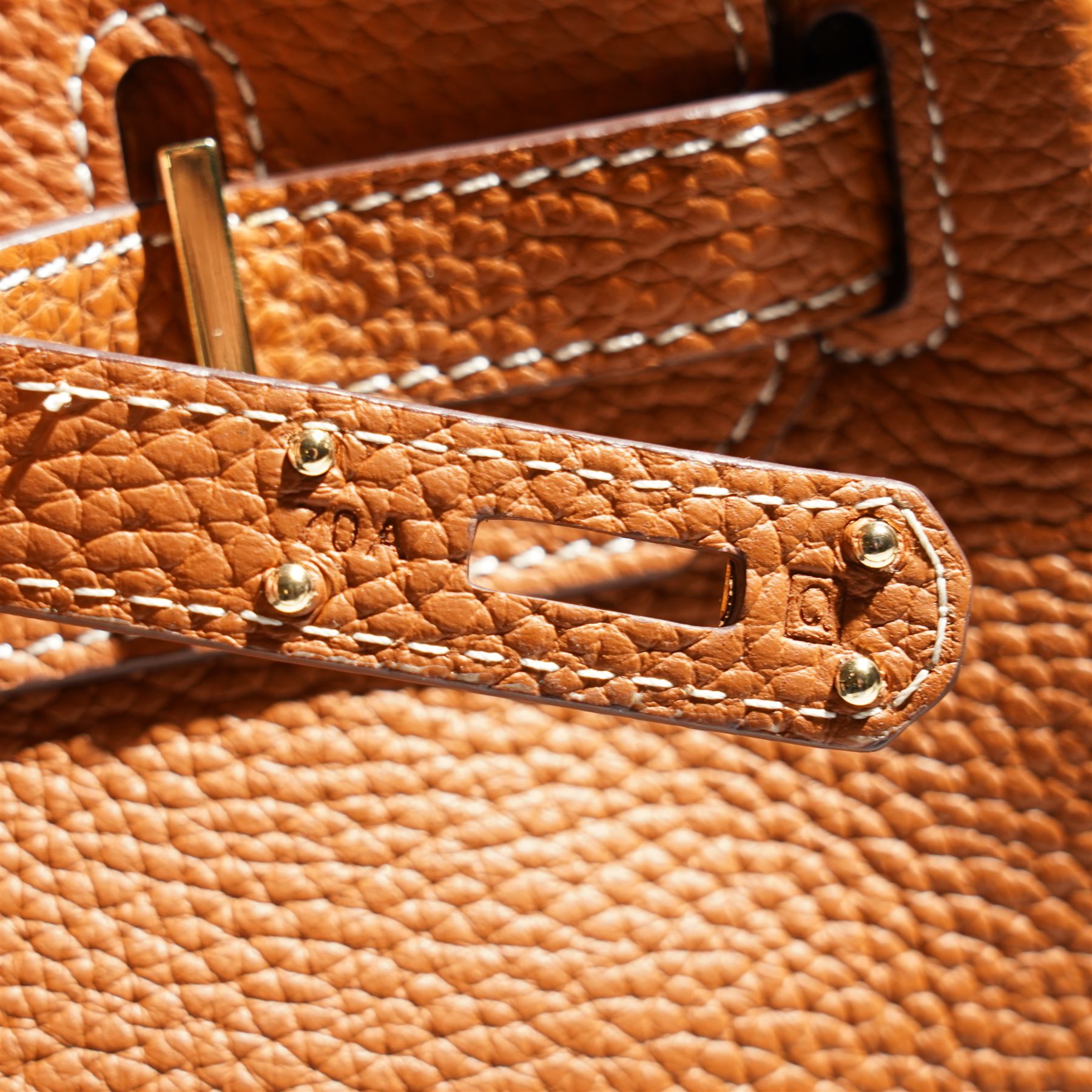 Hermès - gold hardware 'Birkin 35' handbag in gold Togo leather with white stitching, featuring gold-plated hardware, double rolled handles, front flap, belted turn-lock closure, and leather lining with one zip and one slip pocket, stamped 'Hermes Paris Made in France' in gold, with blind-stamp Q (2013) with craftsman’s code 70A to the underside of locking belt. Accompanied by: padlock, keys, clochette, Hermes dust bag, booklet, and ribbon. New unused condition.