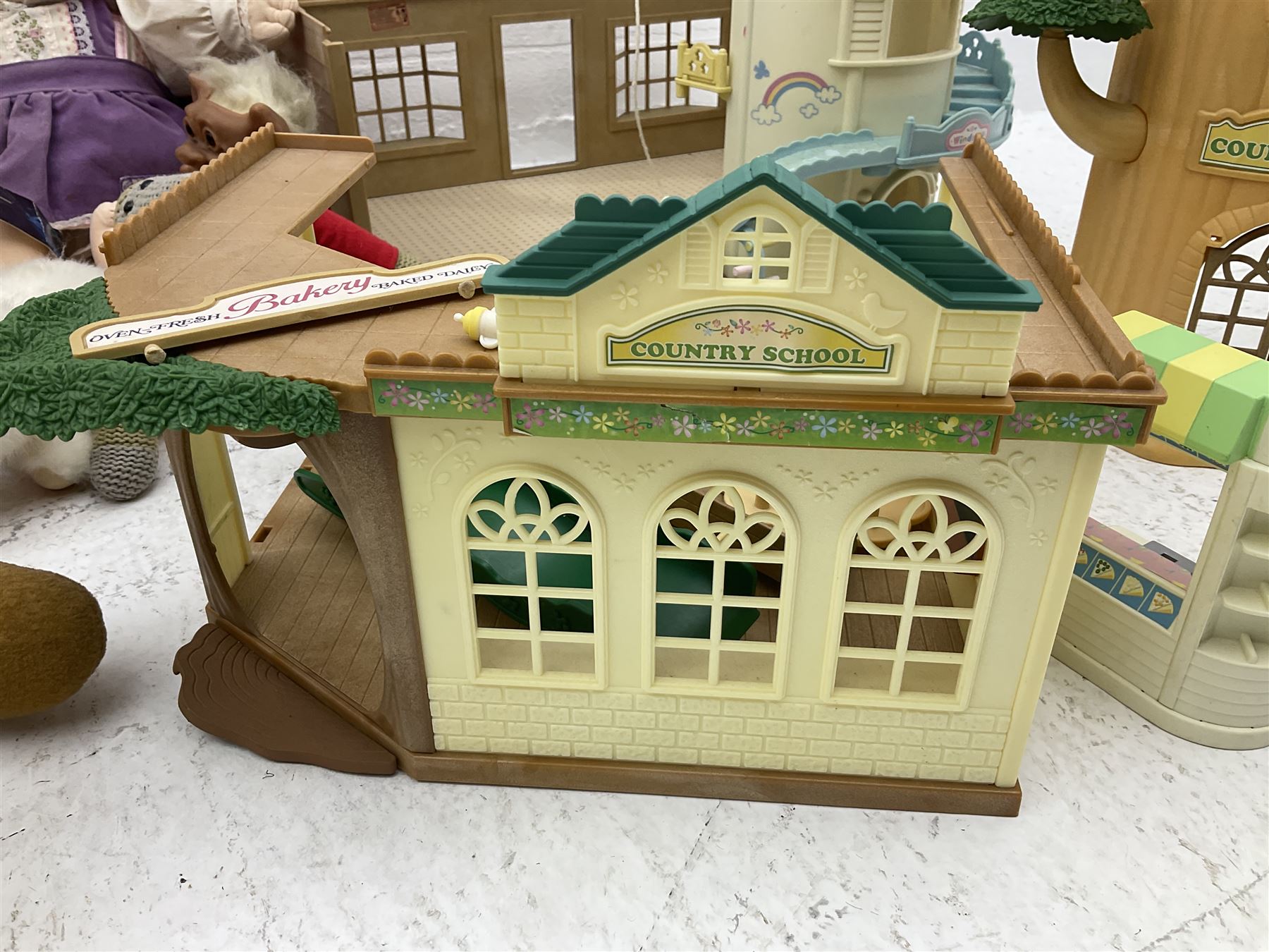 Quantity of stuffed toys and dolls to include Teddy Ruxpin, Cabbage Patch, Troll doll, and a quantity of plastic toys including Sylvanian Families Country School etc, in two boxes