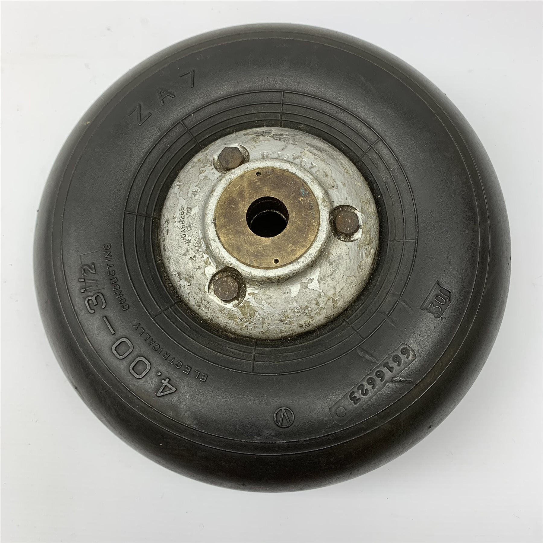 WWII Spitfire/Hurricane pneumatic '4.00 x 3 1/2' tail wheel, aluminium hub with various stamped marks inc. DRG No.AHO5000, brass bushes dia. 26cm