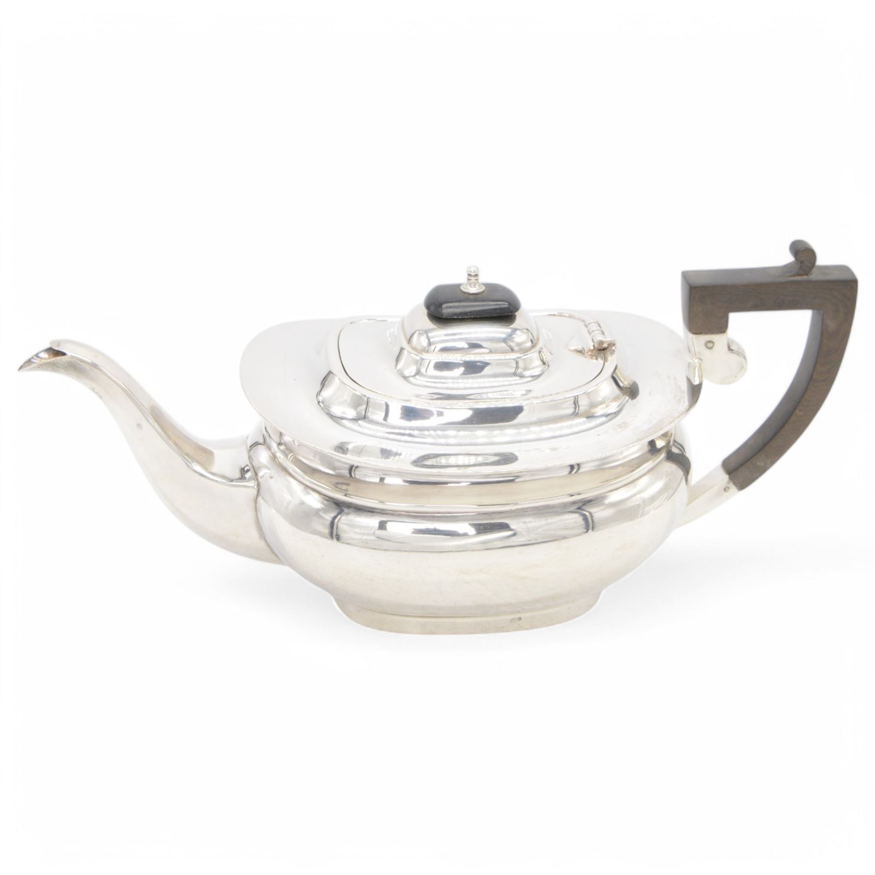 1920s silver tea pot, of oval bellied form, with Bakelite type handle and finial, hallmarked C W Fletcher & Son Ltd, Sheffield 1923, H15cm