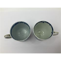 Two 18th century Worcester porcelain coffee cups, the first example decorated in the Plantation pattern, circa 1754, the second decorated in the Mansfield pattern, circa 1760, with workman's mark beneath, each approximately H5.5cm
