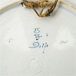 Continental figural group of two owls, possibly by Ernst Bohne & Söhne, modelled in a naturalistic setting, H25cm; together with a model delft charger (2)