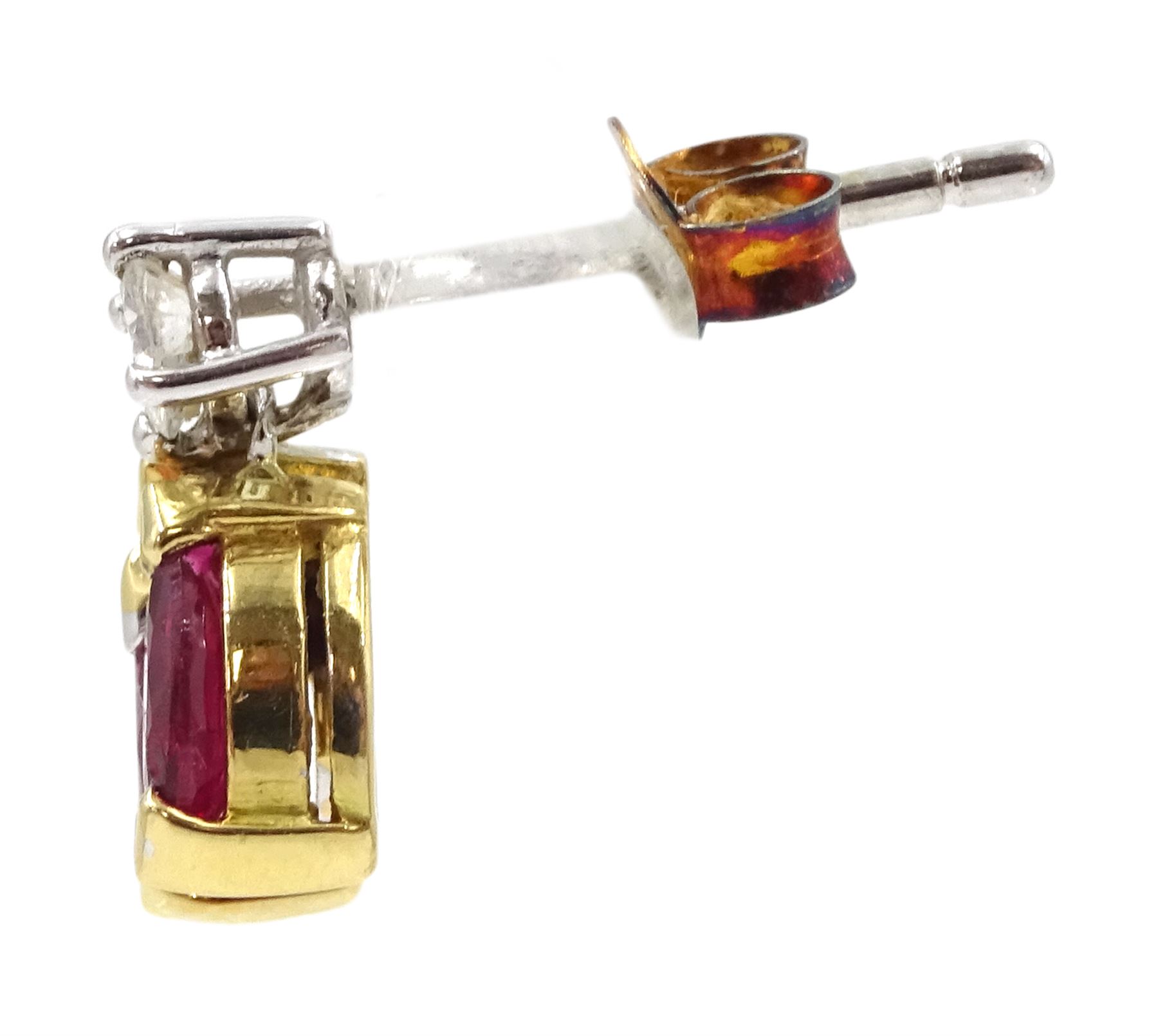 Pair of 18ct white and yellow gold round brilliant cut diamond and marquise cut ruby pendant stud earrings, London 1989, total diamond weight approx 0.20 carat