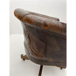 Early to mid 20th century swivel desk tub shaped chair, upholstered in brown leather