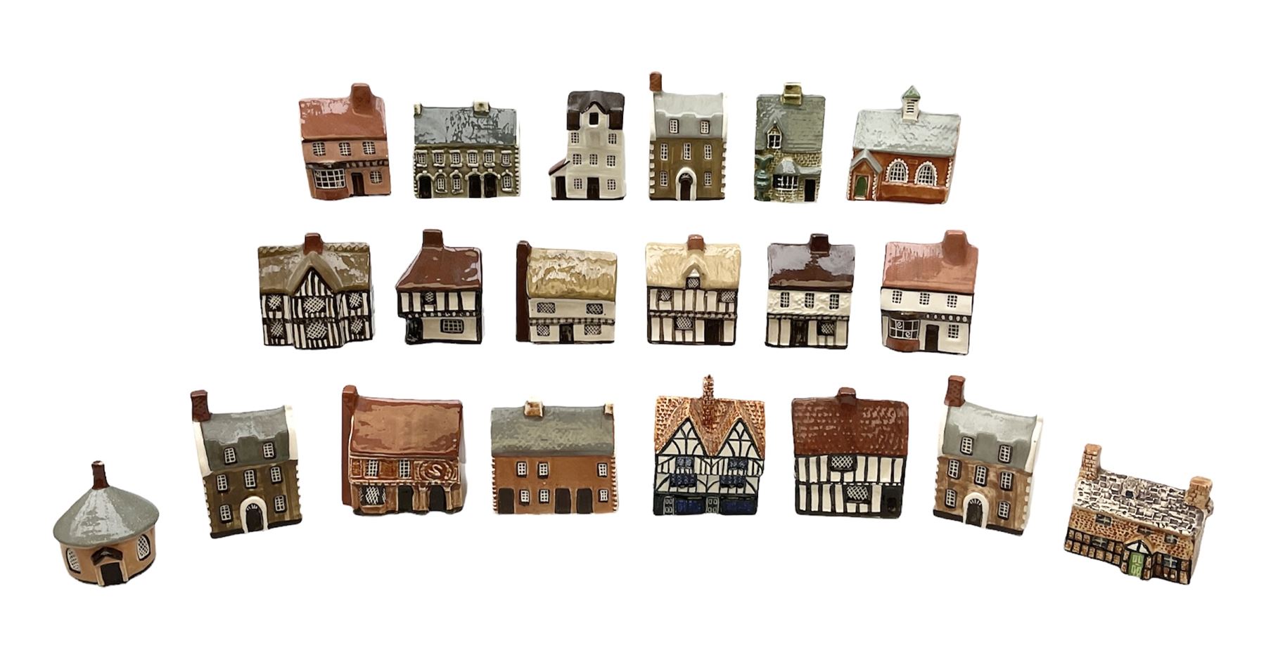 Twenty studio pottery figures of houses and cottages, comprising seventeen Mudlen End Studio Felsham Suffolk examples and two John Putman's Heritage Houses examples