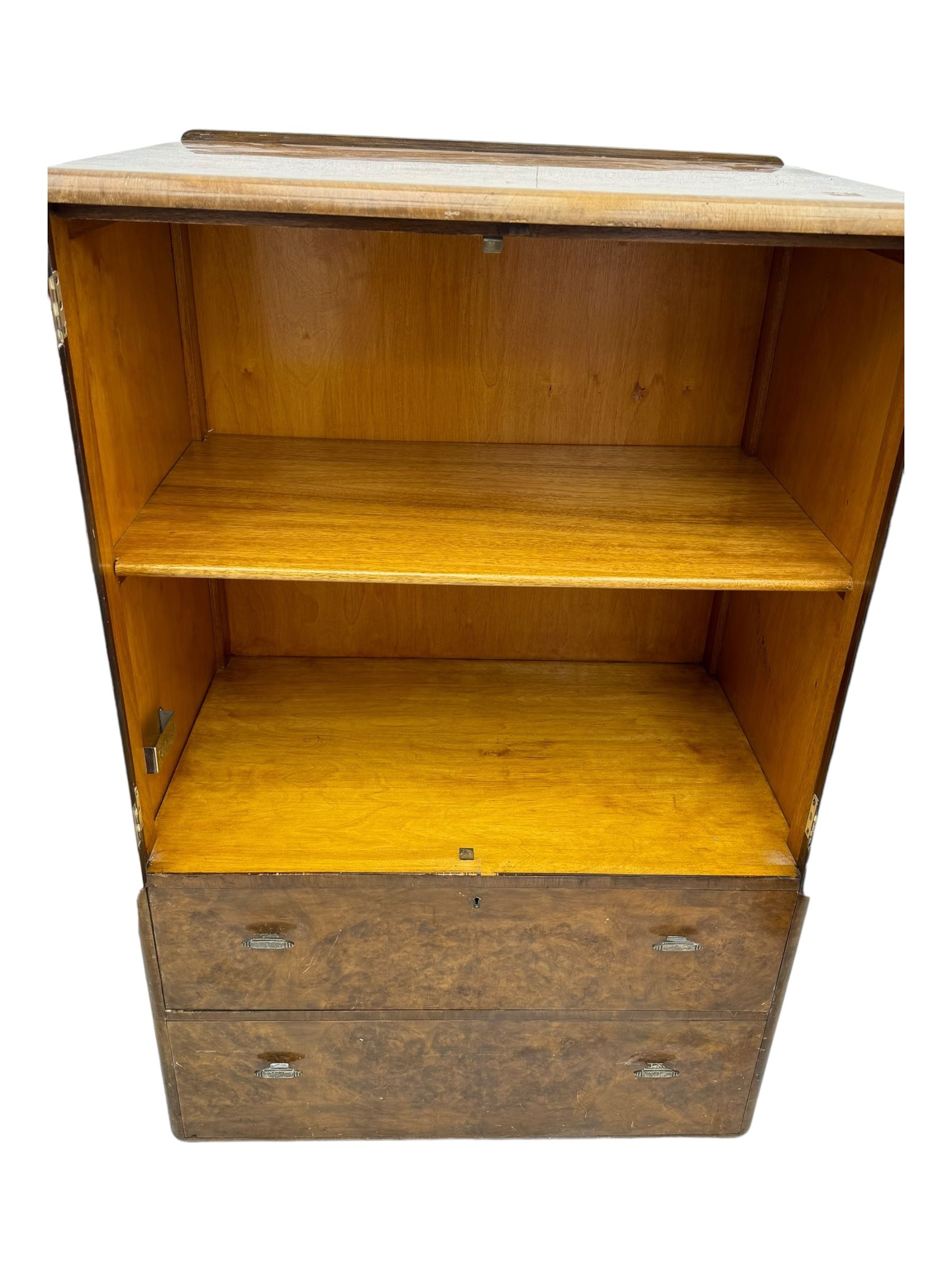 Early 20th century burr walnut cabinet, rectangular top with raised back, over double-door cupboard enclosing camphor interior with single shelf, lower section fitted with two drawers