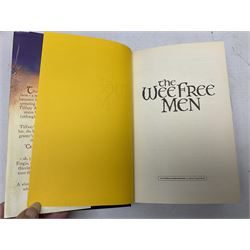 Collection of twenty-three hardback Terry Pratchett books, comprising approximately eighteen first editions including The Fifth Elephant signed & inscribed by Pratchett, all with dustjackets