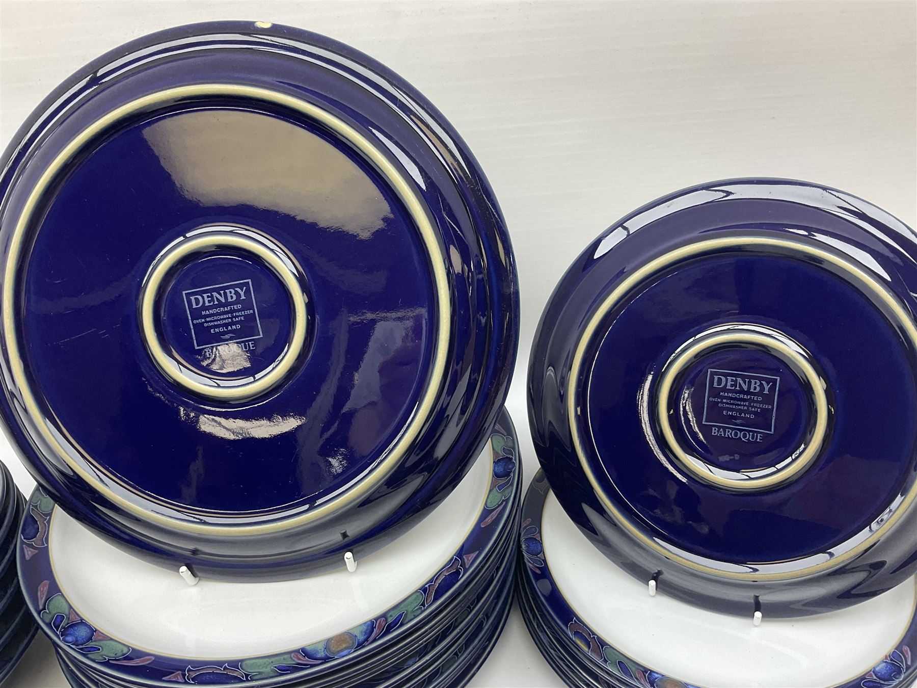 Denby Baroque pattern part tea and dinner service, comprising nine dinner plates, six side plates, six bowls five dessert plates, six cups and saucers, together with a Denby teapot and jug in Imperial blue pattern