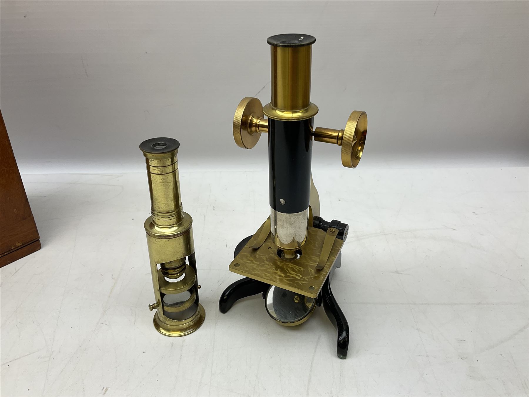  Brass field microscope, together with a cased microscope and twenty five microscope slides