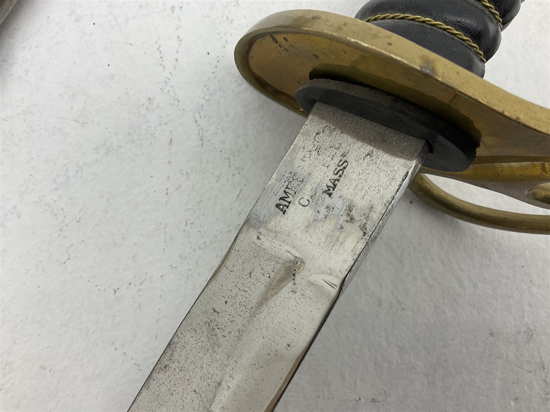 Reproduction American Civil War Cavalry trooper's sword, the 88cm slightly curving fullered steel blade marked to the ricasso 'Ames & Co Chicopee Mass.' and 'US ADK 1862'; brass hilt and leather covered grip; in steel scabbard L110cm overall;  and another reproduction sword (2)