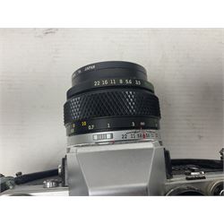 Olympus OM-2 camera body, serial no 1117526, with Olympus OM-System Zuiko Auto-W 28mm 1:2.8'  lens serial no 336591, Olympus OM10 camera body serial no 2392257, with Olympus OM-System Zuiko Auto-Macro 50mm 1:3.5' lens serial no 225784, Soligor C/D mirror lens 1:8 f=500mm' serial no 784035650 together with other camera equipment 