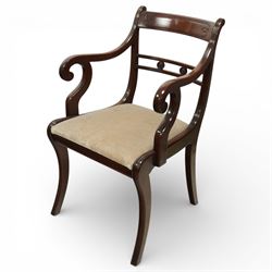 Arthur Brett & Sons - Regency design mahogany extending dining table and eight chairs, the oval top with rounded ends and two extension leaves, raised on twin pedestal supports with swept legs terminating in brass caps and castors, accompanied by a set of eight chairs comprising six single chairs and a pair of carvers, the chairs with curved backs and horizontal splat rails, upholstered seats, sabre legs and scrolling arms to the carvers
(Extends to 252cm)
(Chairs H 86cm, W 52cm)
