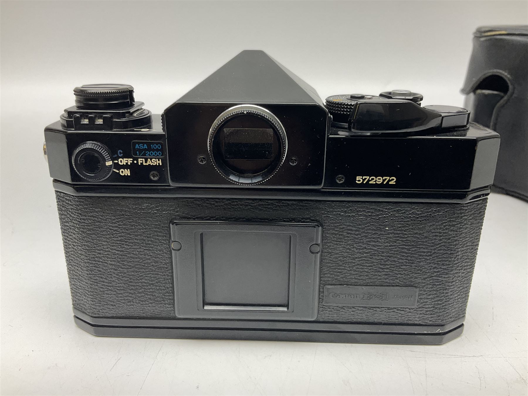 Canon F1n camera body, serial no. 572972, with 'Canon FD 50mm 1:1.4' lens, serial no. 246665, with leather case 
