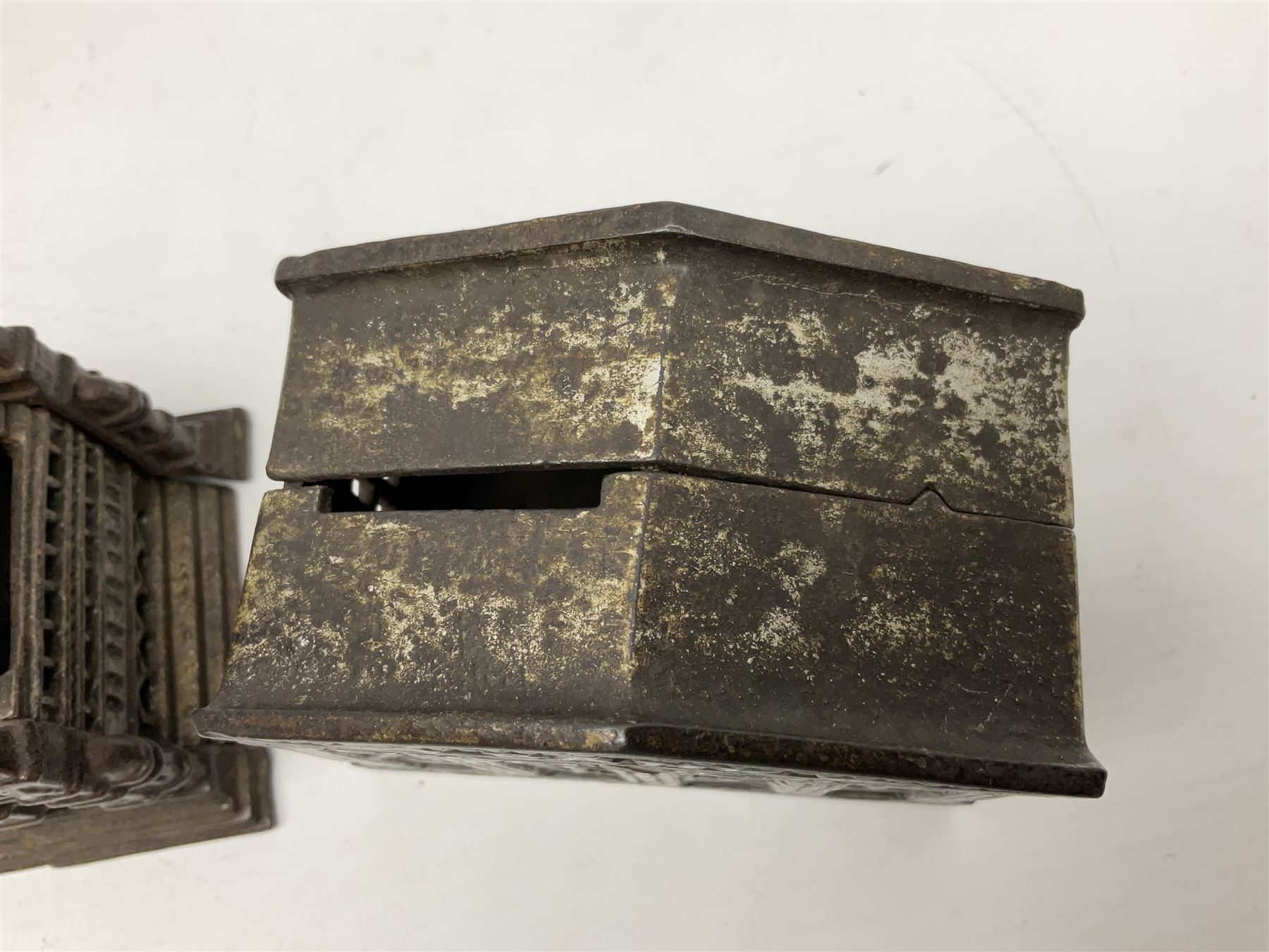 Five early 20th century cast-iron money banks as buildings - 'City Bank' c1904 H10cm; 'County Bank' c1905 H11cm; 'Town Hall Bank' c1900 H8.5cm; 'Tower Bank' c1902 H23.5cm; all made by John Harper; and 'Blackpool Tower Bank' c1907 by Chamberlain & Hill H18.5cm (5)