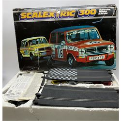 Scalextric - set 60 with Aston Martin and Ferrari cars, boxed with instruction pack; and set 300 with two Mini cars, boxed with paperwork (2)