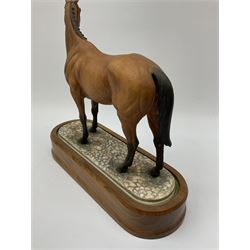 A Royal Worcester limited edition figure, Arkle, owned by the Duchess of Westminster, modelled by Doris Lindner, on wooden base, H27cm. 