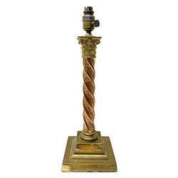 Early 20th century brass and copper Corinthian column table lamp, the square stepped brass base leading to a spiral twist copper column and brass Corinthian capital, H44.5cm 
