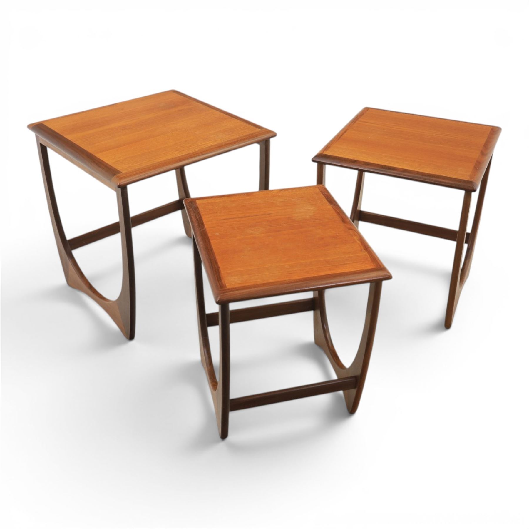 G-Plan - 'Astro' teak nest of three tables, square top with shaped supports