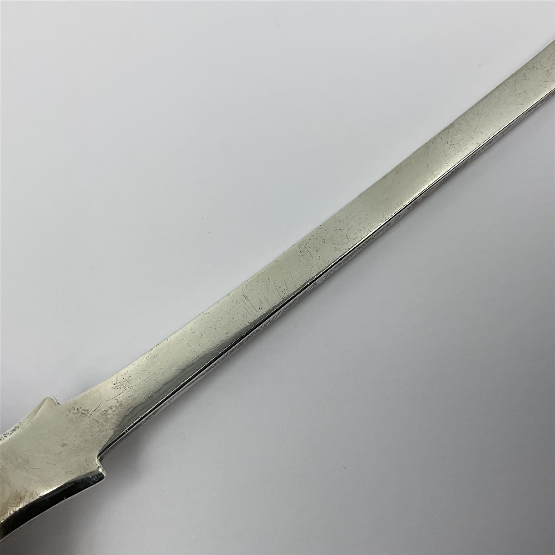 Victorian Newcastle silver Fiddle Shell pattern serving spoon, the terminal engraved with crest of a fist holding an arrow aloft, hallmarked Lister & Sons, Newcastle 1862, L31cm