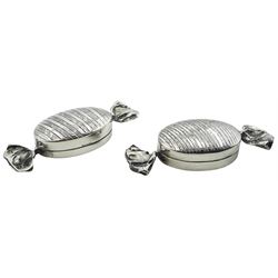 Two novelty modern silver pill boxes modelled in the form of sweets, with engine turned decoration to the main bodies, each hallmarked C M E Jewellery Ltd, Birmingham import 1994, and stamped 925, approximate weight 0.81 ozt (25.4 grams)