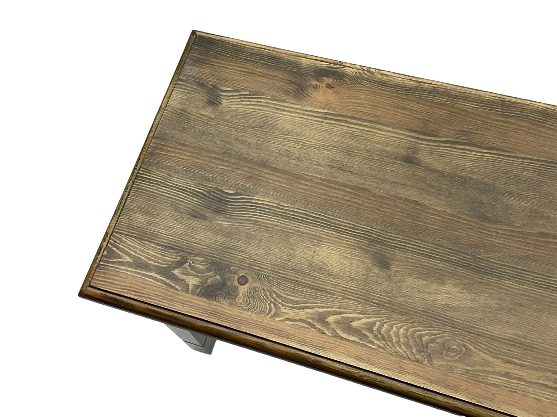 Pine kitchen dining table, rectangular moulded top on painted base, square tapering supports (180cm x 85cm, H78cm); and two matching benches 