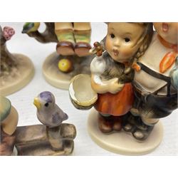 Seven Goebel Hummel figures, comprising Chimney Sweep 12/I, Apple Tree Girl 14/I, Apple Tree Boy,  Little Goat Herder 200/I, Surprise 94 3/0, Signs of Spring 203/20 and Wayside Harmony 111/30, tallest H15cm