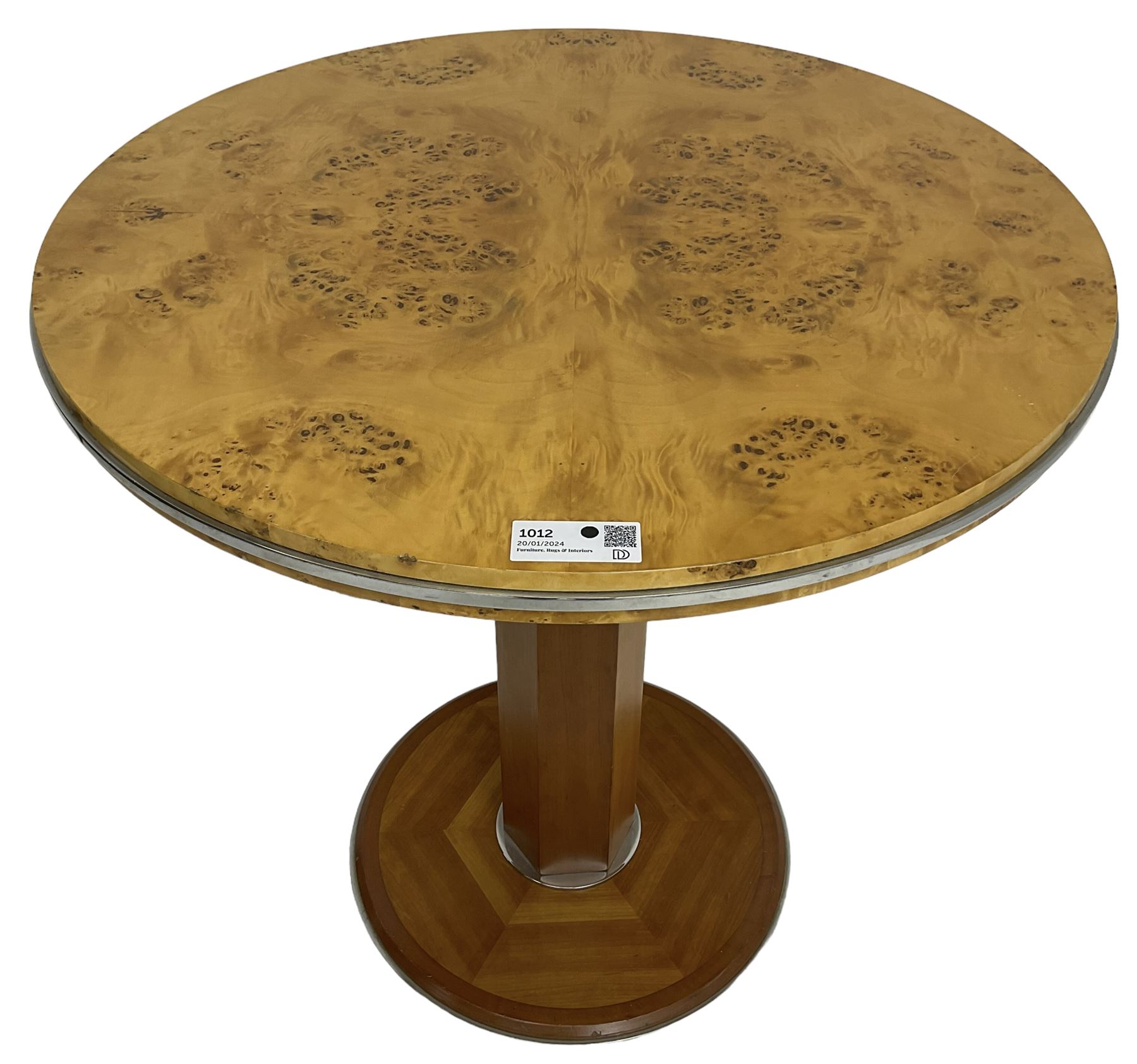 Art Deco design maple and cherry wood pedestal table, circular top with figured quarter matched veneers, mounted by chromed metal band, octagonal pedestal on circular platform base
