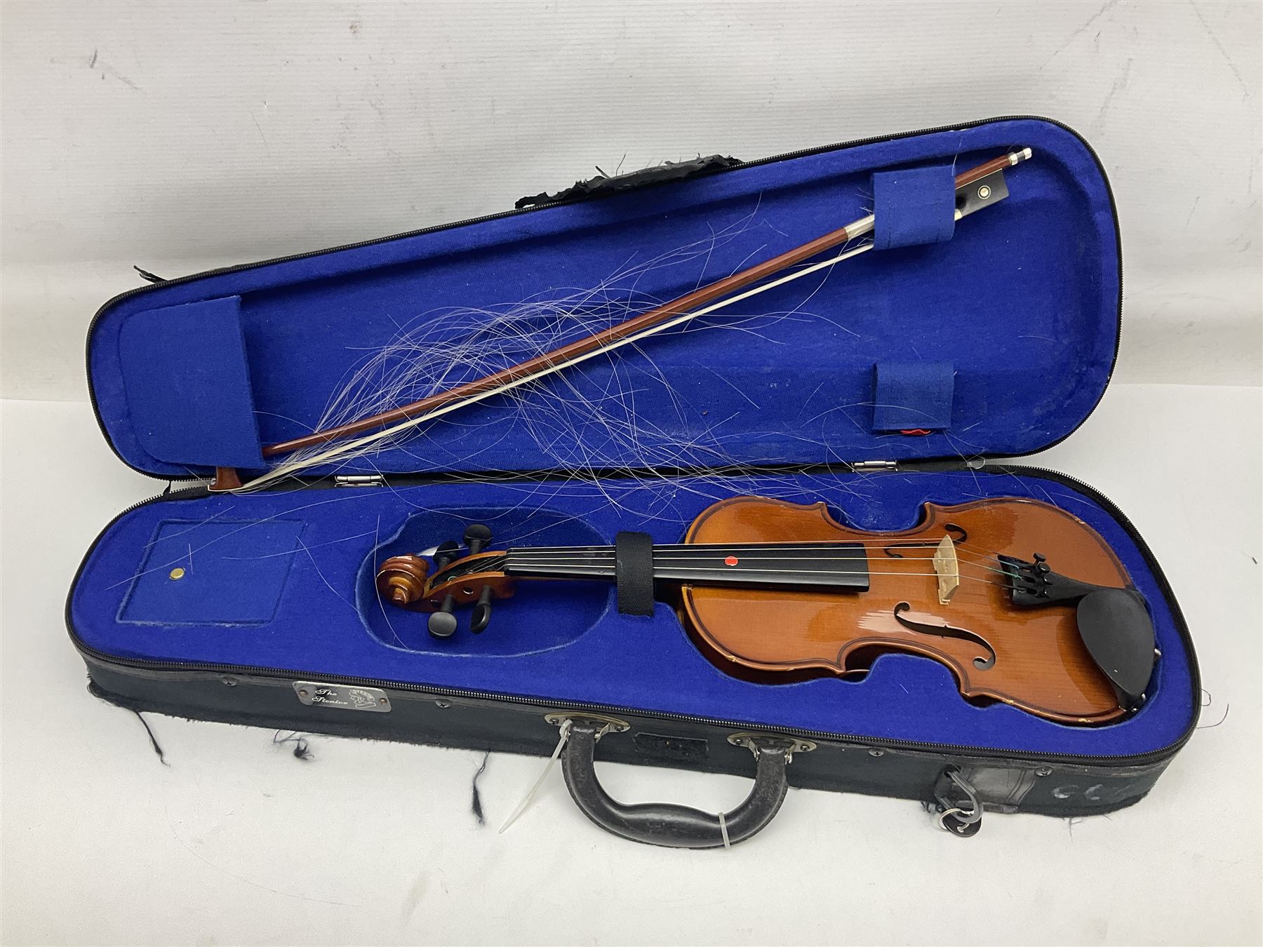 Three Stentor Student violins - three-quarter size with 33cm two-piece back; and two quarter size each with 28cm two-piece back; each in carrying case with bow (3)