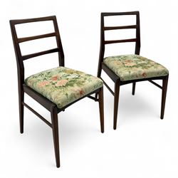 Richard Hornby for Fyne Ladye - mid-20th century afromosia teak dining table, tapered rectangular top with fluted edge and recess for spare leaf, raised on slender legs, teak framed chairs, of ladder back design, with drop-in seat, upholstered seat, with tapered front legs and slightly raked rear legs, retailed by Heals of London, table extended width 181cm depth 86cm height 74cm - chairs width 48cm depth 41cm height 87cm 