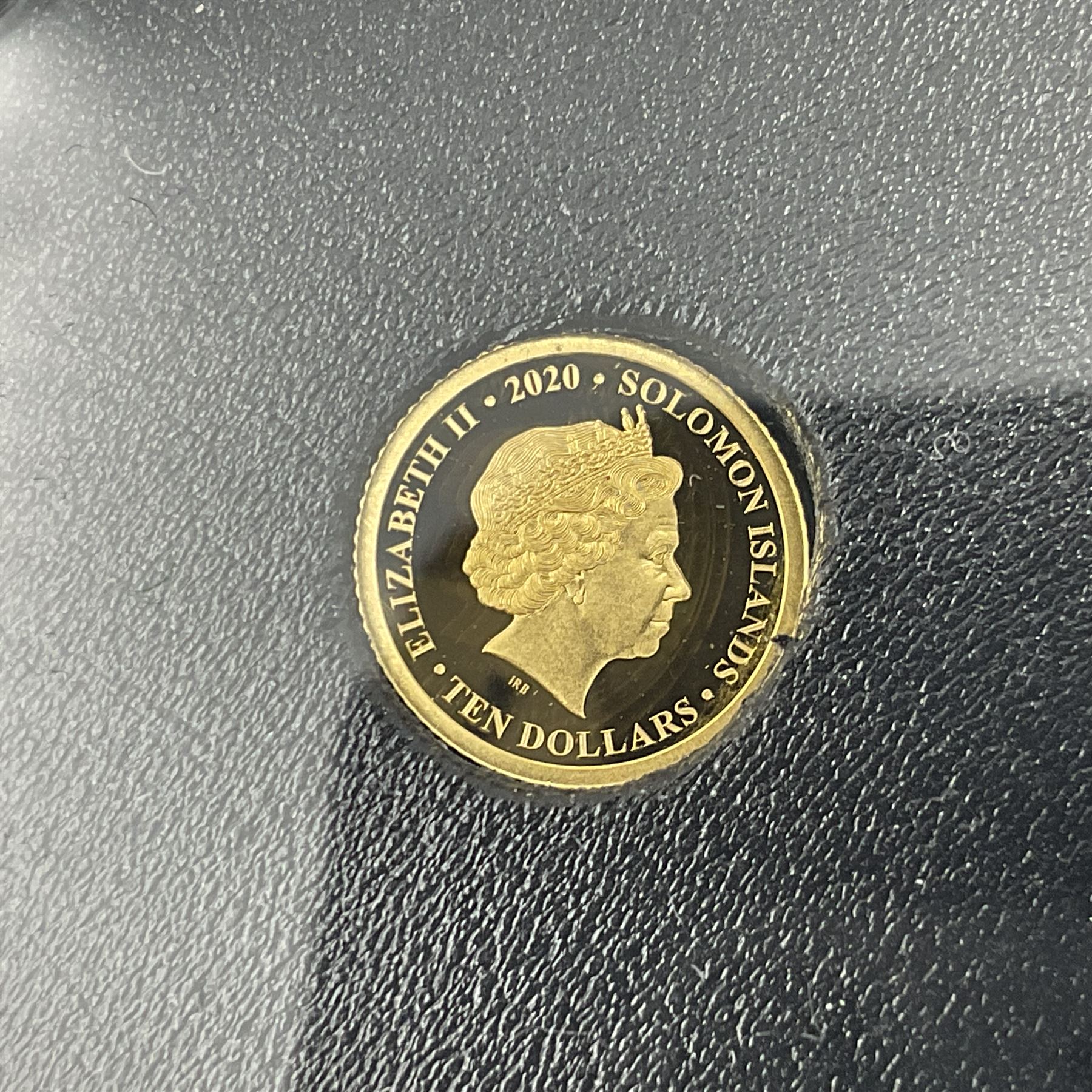Eleven Queen Elizabeth II miniature gold coins, each being 0.5 grams of 24 carat gold, including Tristan da Cunha 2020 'Laurel', Solomon Islands 2020 '80th Anniversary of the Battle of Britain' etc, all with certificates