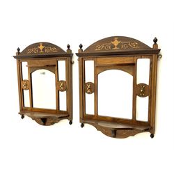 Pair Edwardian rosewood hallway wall mirrors, arched pediment inlaid with urn and scrolling foliate, bevelled mirror panels, each with two small shelves