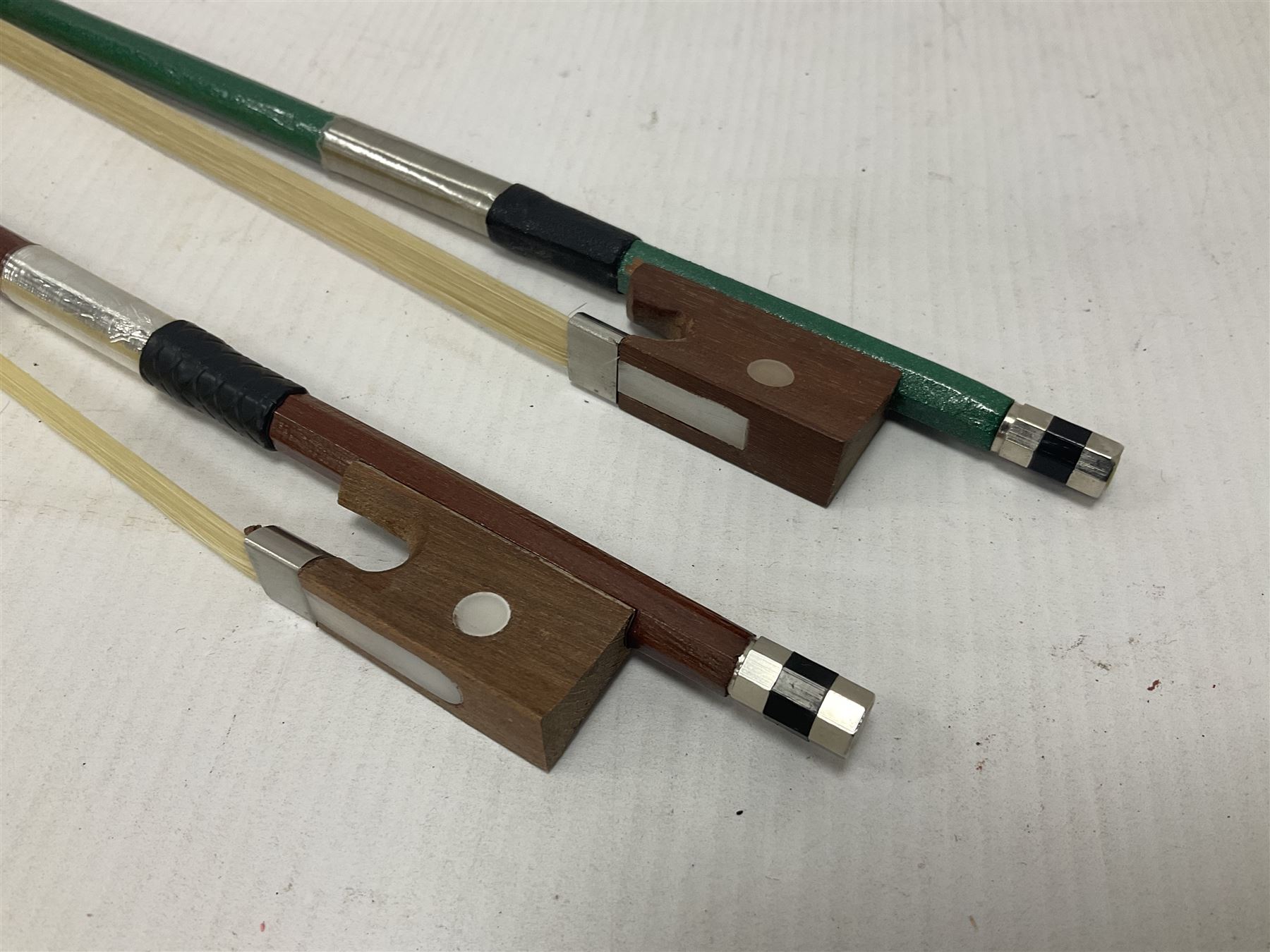 Zest full size pink violin, with a solid wood body and maple head, with matching pink bow and two further bows, in a hard case Length 60cm