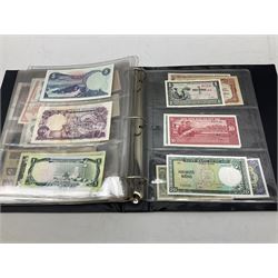 World banknotes, including Queen Elizabeth II The States of Jersey one pound 'DB202703', five pounds 'BB527762' and ten pounds 'AB651481', reserve bank of New Zealand two dollars '1L3 741894', King George V Straits Settlements one dollar 1st January 1935 'F/83 28924', various Bank of England notes etc, housed in two ring binder albums