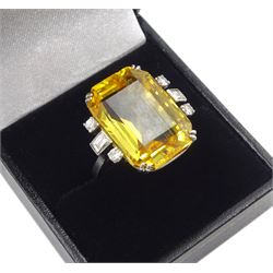 Palladium natural yellow sapphire ring, set with three baguette and round cut diamonds either side, sapphire approx 28.00 carat, with The Gem & Pearl Laboratory report stating no evidence of heat treatment, origin opinion Sri Lanka, colour transparent yellow