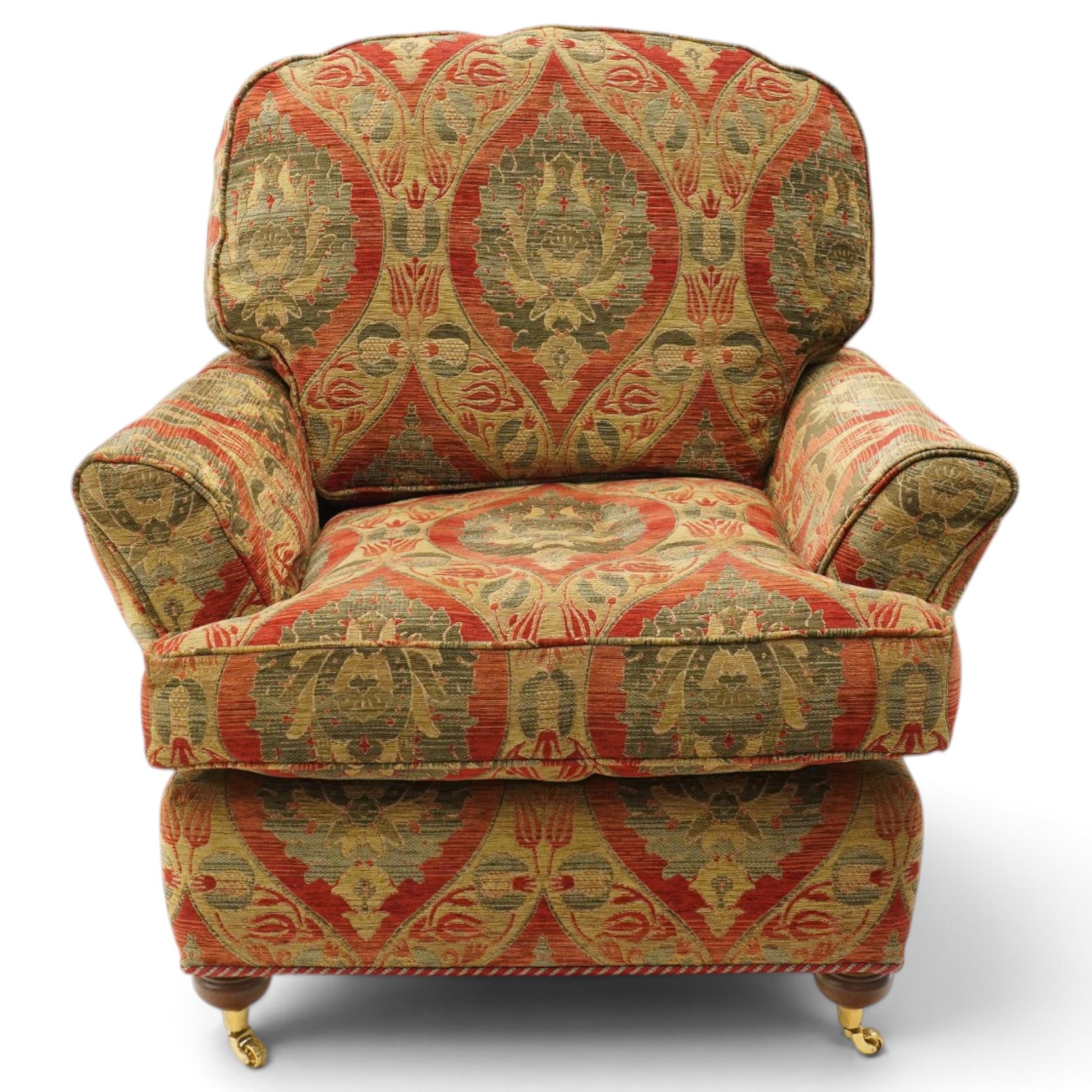 Duresta - traditional shape armchair with out-swept arms, upholstered in crimson ground fabric decorated with palmettes and foliate motifs with matching loose and scatter cushions, raised on compressed bun feet with brass cups and castors
