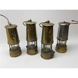 Four miner's lamps - two all brass by The Protector Lamp & Lighting Co. Ltd.H25cm; and two (one all brass and one brass/steel) bearing Ashington Colliery plaques (4)