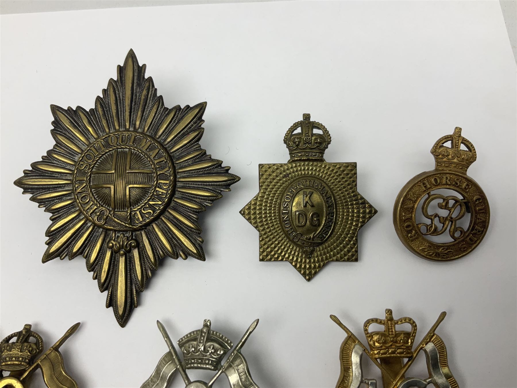 Nine Lancers metal cap badges including 9th, 12th Royals, 24th, 16th Queens and 17th; together with eight various Guards/Dragoons badges (17)