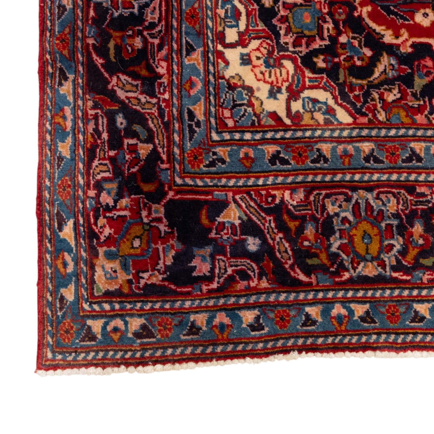 Two Persian rugs, the larger with a crimson field decorated with three linked indigo medallions amongst flowering tendrils, shaped floral spandrels and an indigo palmette border, (161cm x 129cm), the smaller with a crimson field centred by an ivory rosette amongst stylised flowering plants, within a dark floral border, (114cm x 79cm) (2)